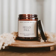 Sweet Water Decor Hello Fall Candle, 9oz Amber Jar, Autumn Scents for Home | Hot Cider, Cinnamon, Cloves, & Nutmeg Soy Wax Scent Notes, 40+ Hour Burn Time, Glass Jar, Black Lid, Thanksgiving & Halloween