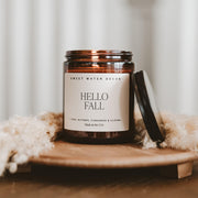 Sweet Water Decor Hello Fall Candle, 9oz Amber Jar, Autumn Scents for Home | Hot Cider, Cinnamon, Cloves, & Nutmeg Soy Wax Scent Notes, 40+ Hour Burn Time, Glass Jar, Black Lid, Thanksgiving & Halloween